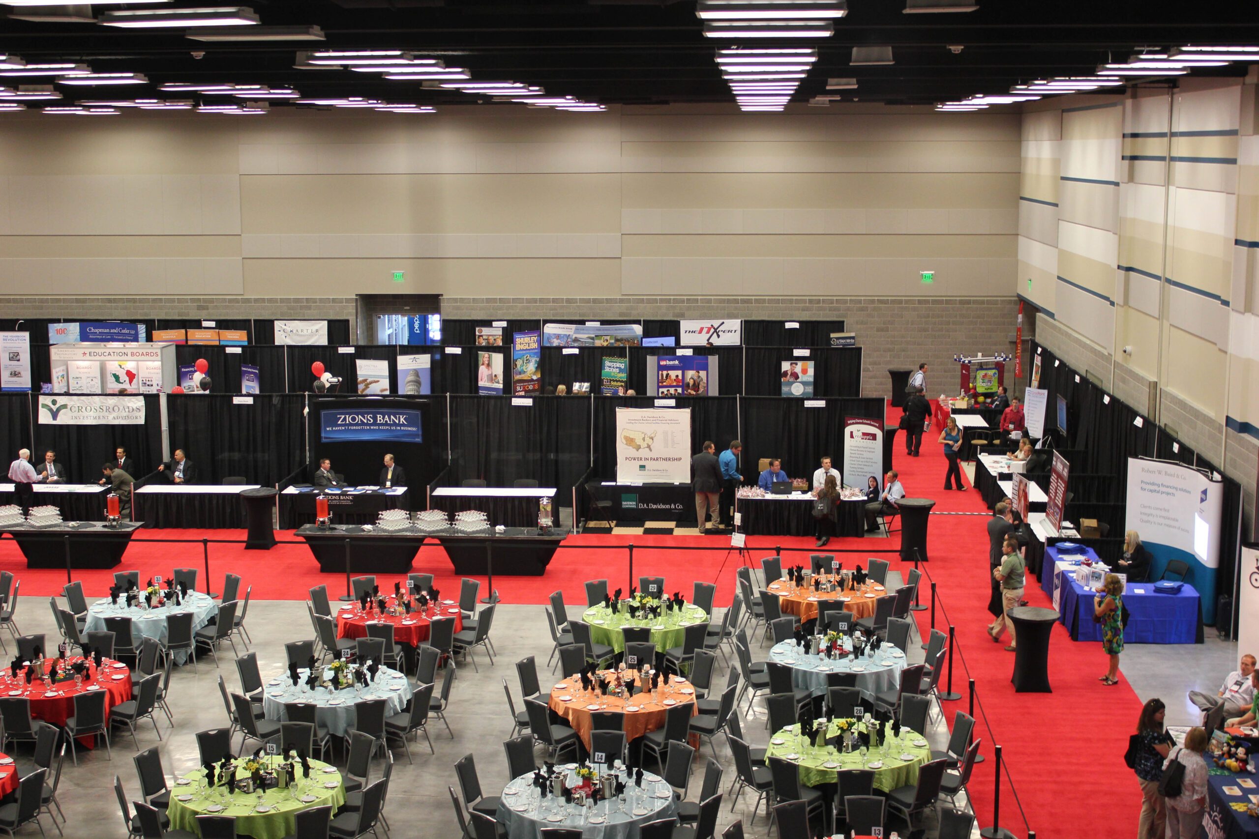 trade show booths and round tables for dining