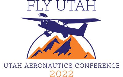 airplane flying over a mountain; logo for Utah Aeronatics conference 2022