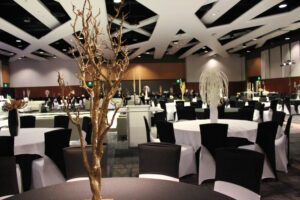 Elegantly decorated banquet hall with round tables